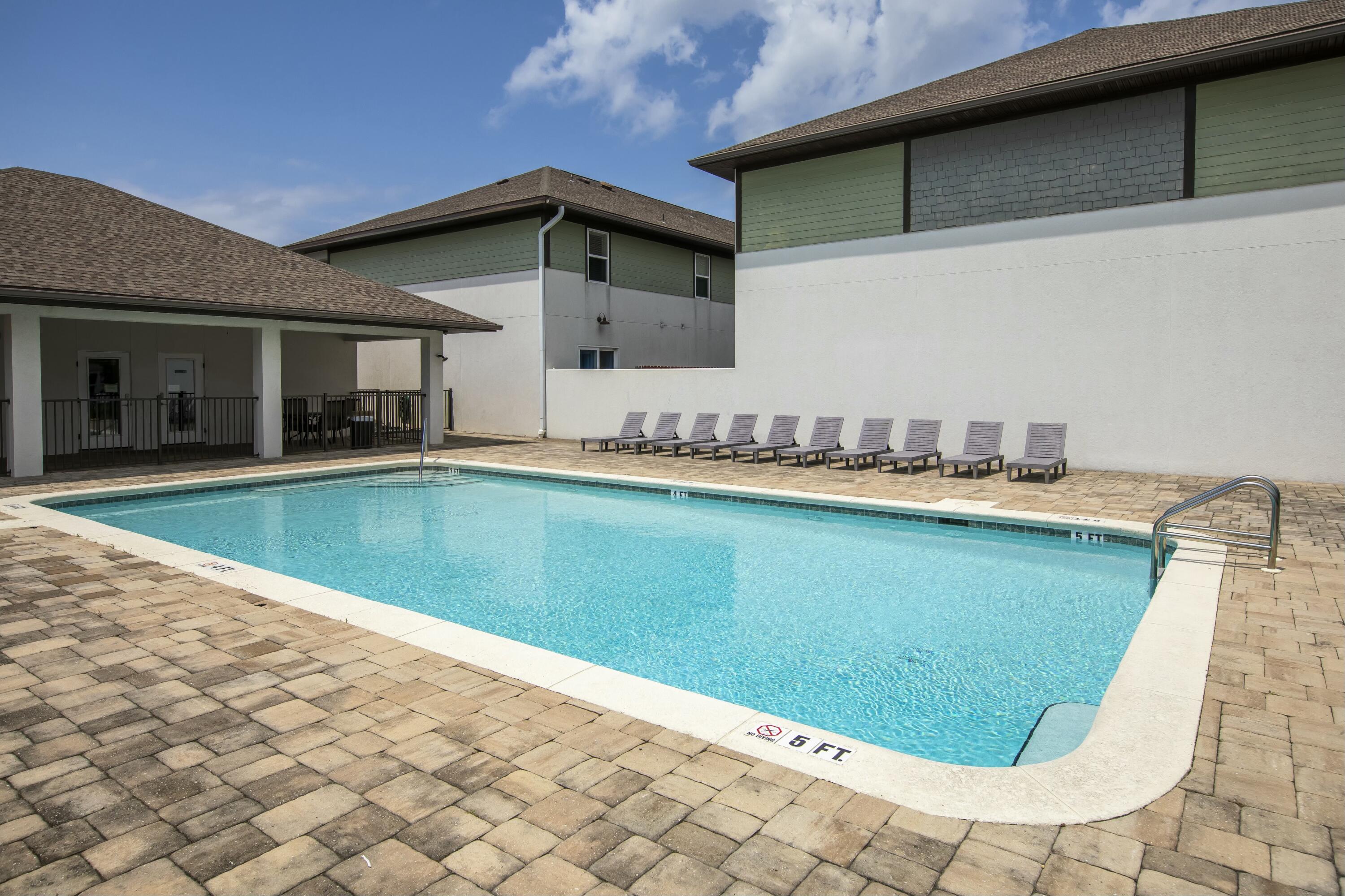 995 Airport Road, Unit 37 Destin, FL 32541 - Photo 42 of 46 a view of a backyard with swimming pool