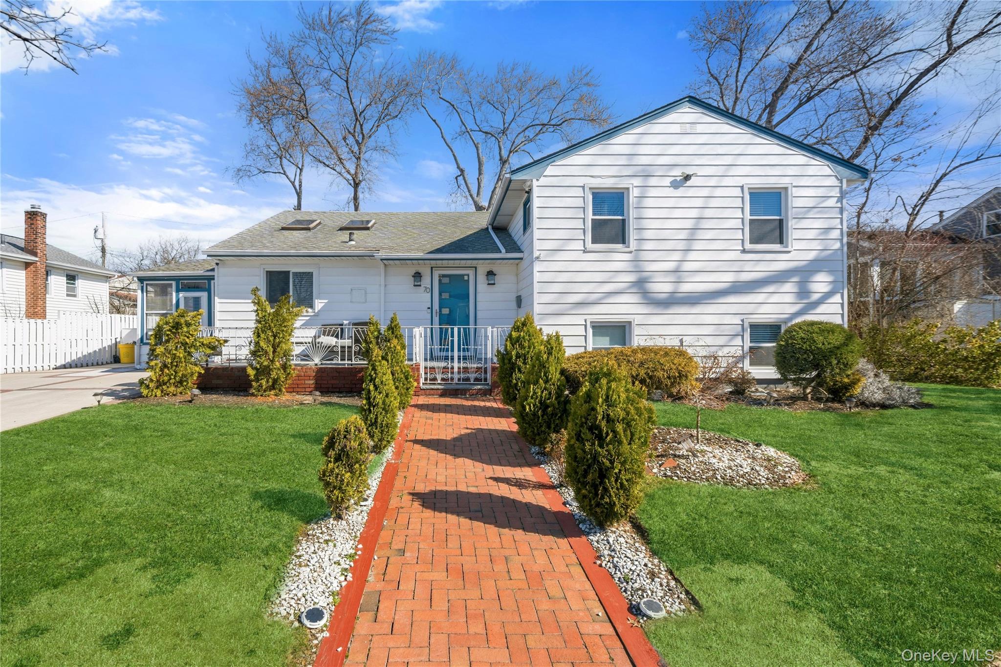 70 Forest Road Valley Stream, NY 11581 - Photo 1 of 43 a front view of a house with a yard