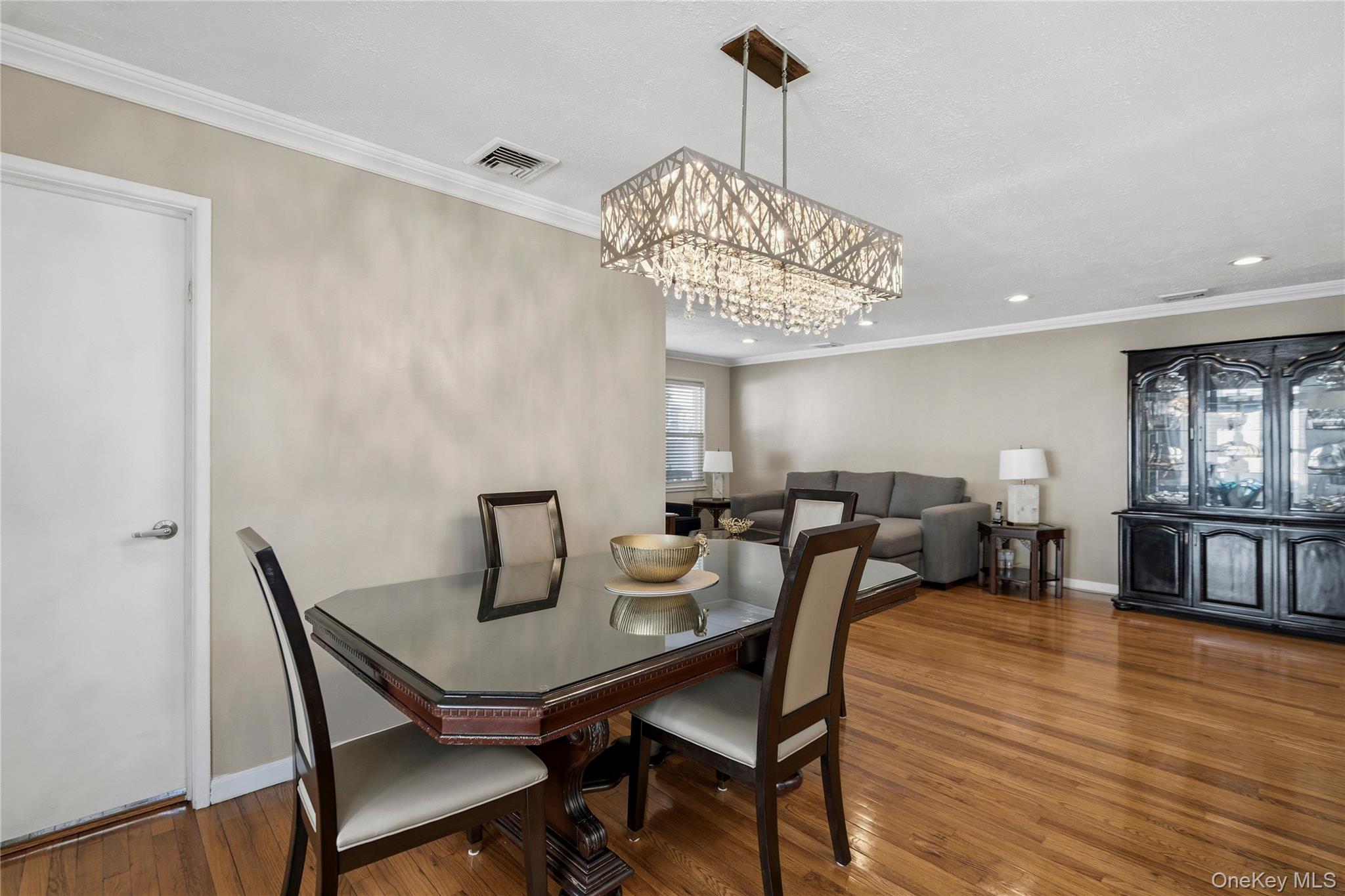 70 Forest Road Valley Stream, NY 11581 - Photo 14 of 43 a view of a dining room with furniture window and wooden floor