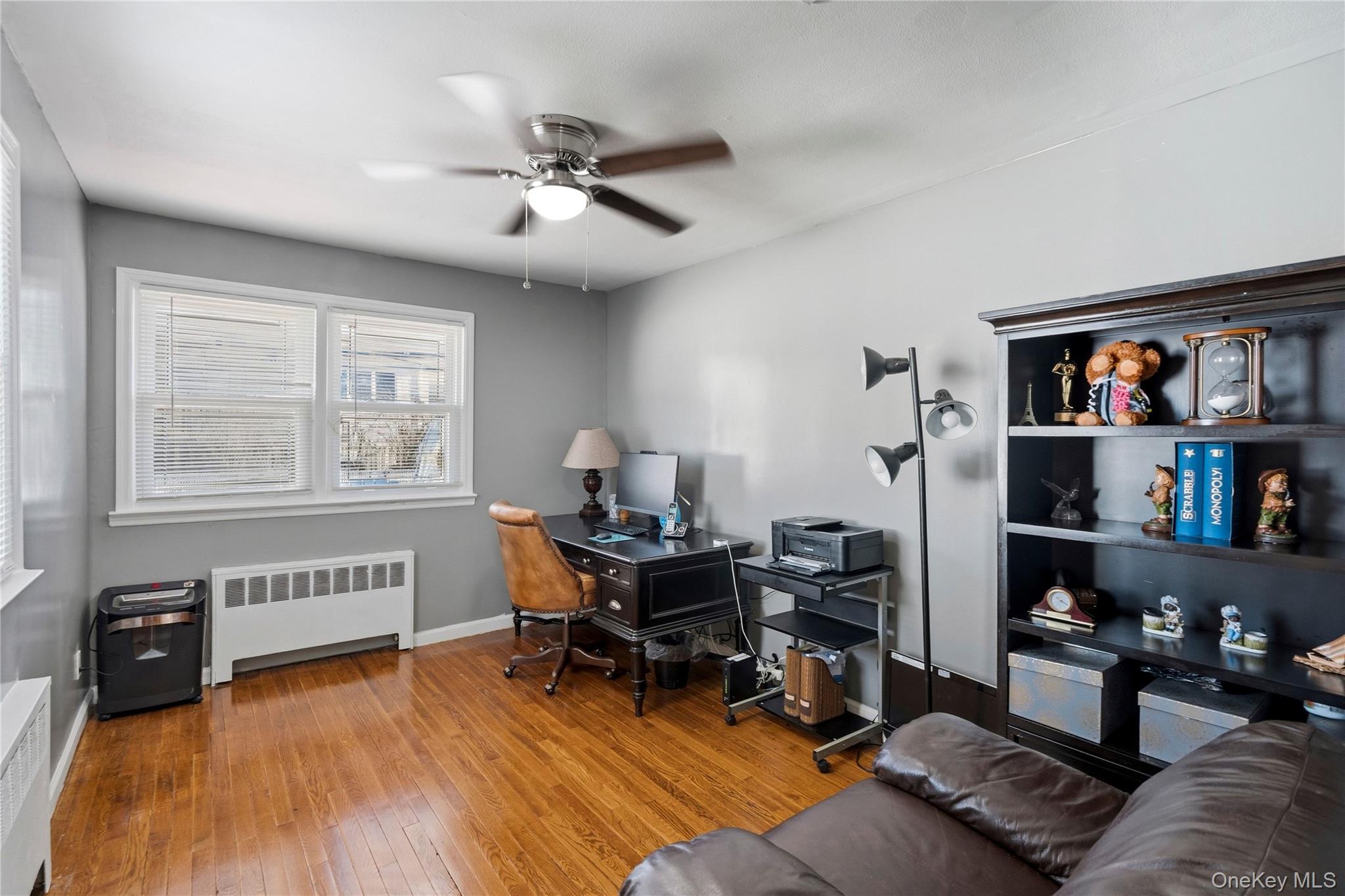 70 Forest Road Valley Stream, NY 11581 - Photo 18 of 43 a view of a workspace with furniture and a window