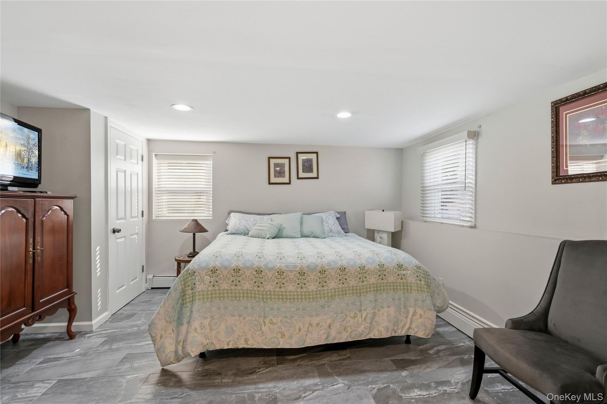 70 Forest Road Valley Stream, NY 11581 - Photo 19 of 43 a bedroom with a bed and wooden floor