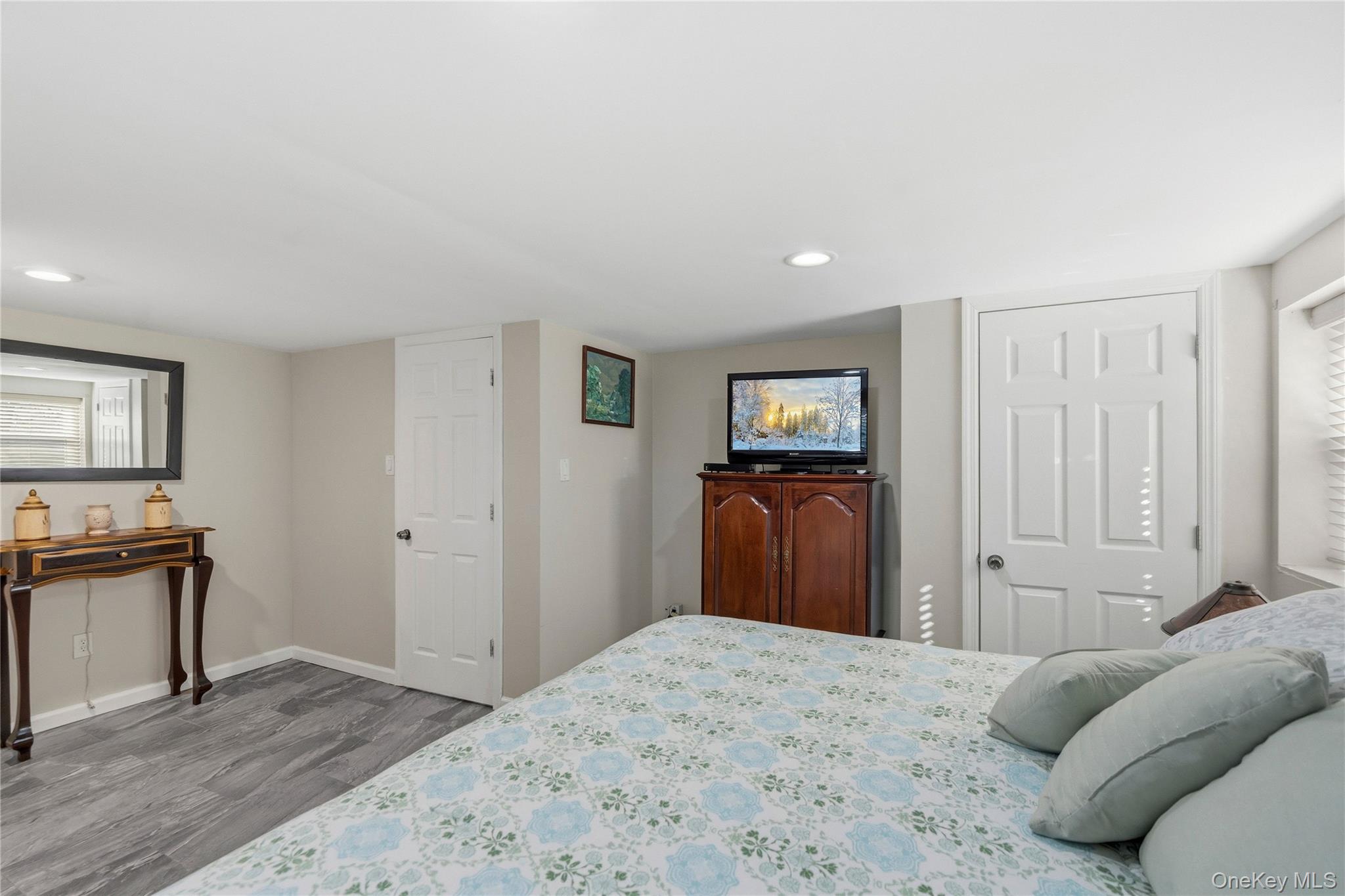 70 Forest Road Valley Stream, NY 11581 - Photo 20 of 43 a bedroom with a bed and a dresser