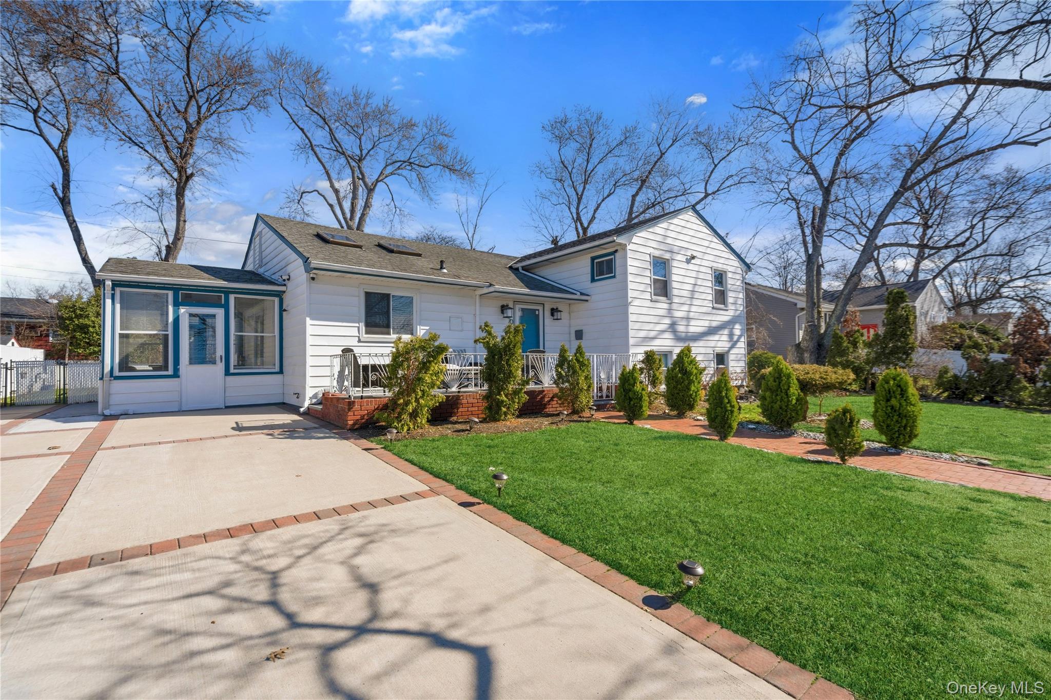 70 Forest Road Valley Stream, NY 11581 - Photo 2 of 43 a front view of house with yard and green space