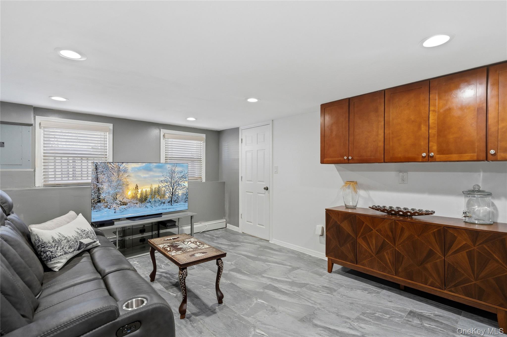 70 Forest Road Valley Stream, NY 11581 - Photo 26 of 43 a living room with furniture and a flat screen tv