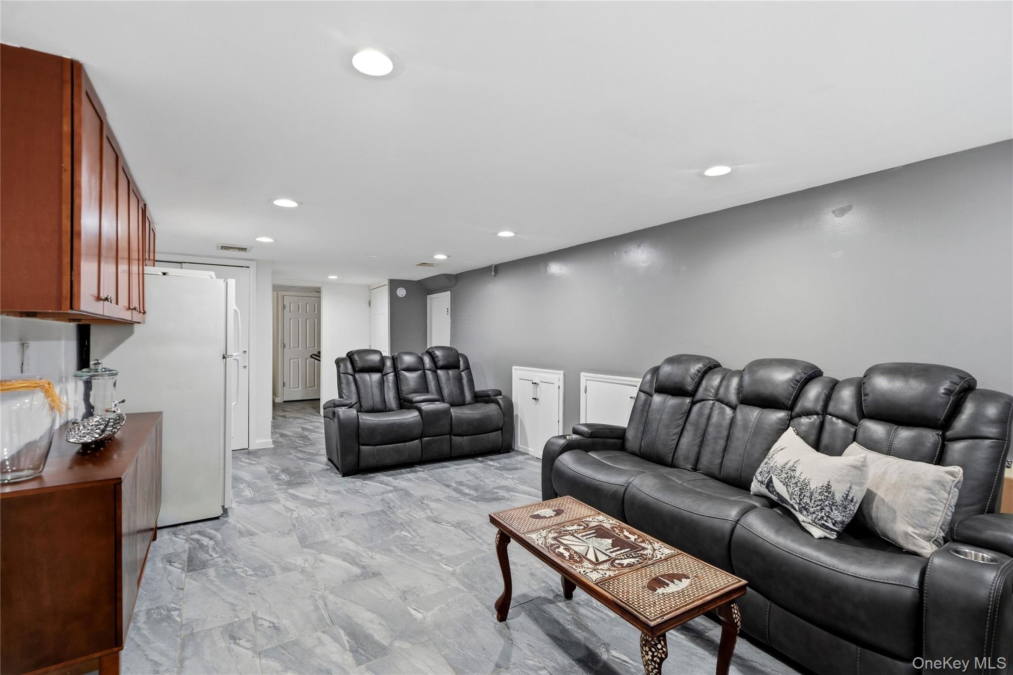 70 Forest Road Valley Stream, NY 11581 - Photo 27 of 43 a living room with furniture and a couch