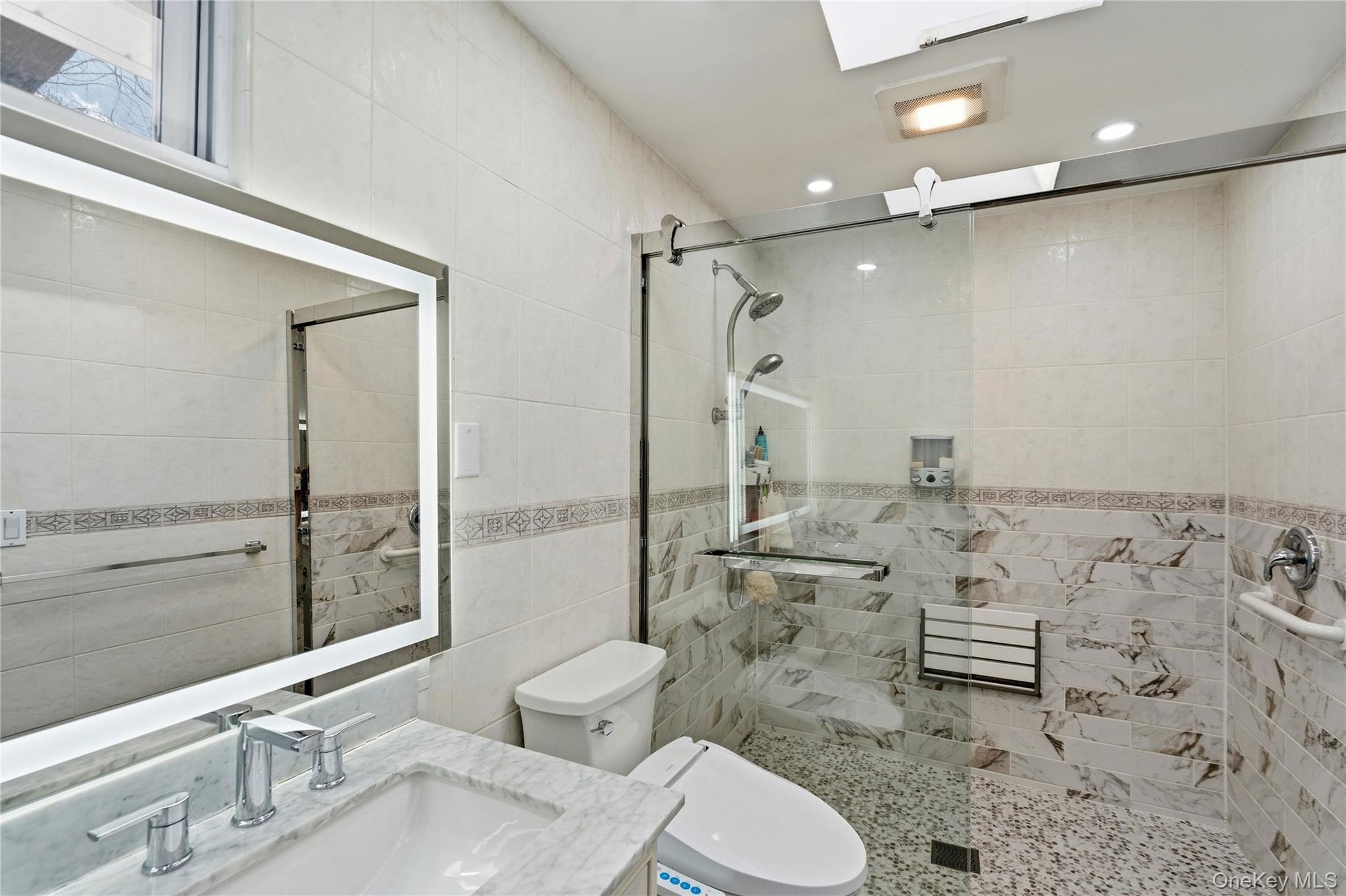 70 Forest Road Valley Stream, NY 11581 - Photo 31 of 43 a bathroom with a sink toilet and shower