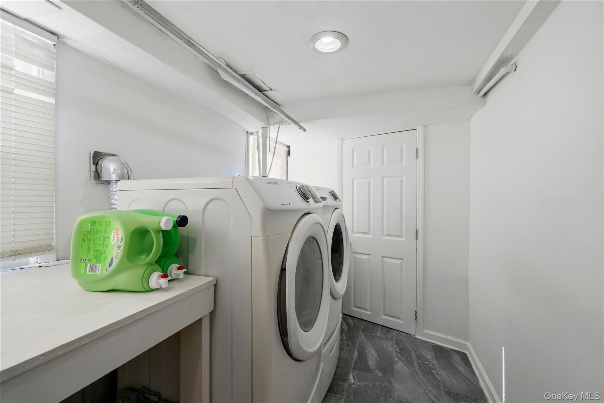 70 Forest Road Valley Stream, NY 11581 - Photo 34 of 43 a utility room with dryer and washer