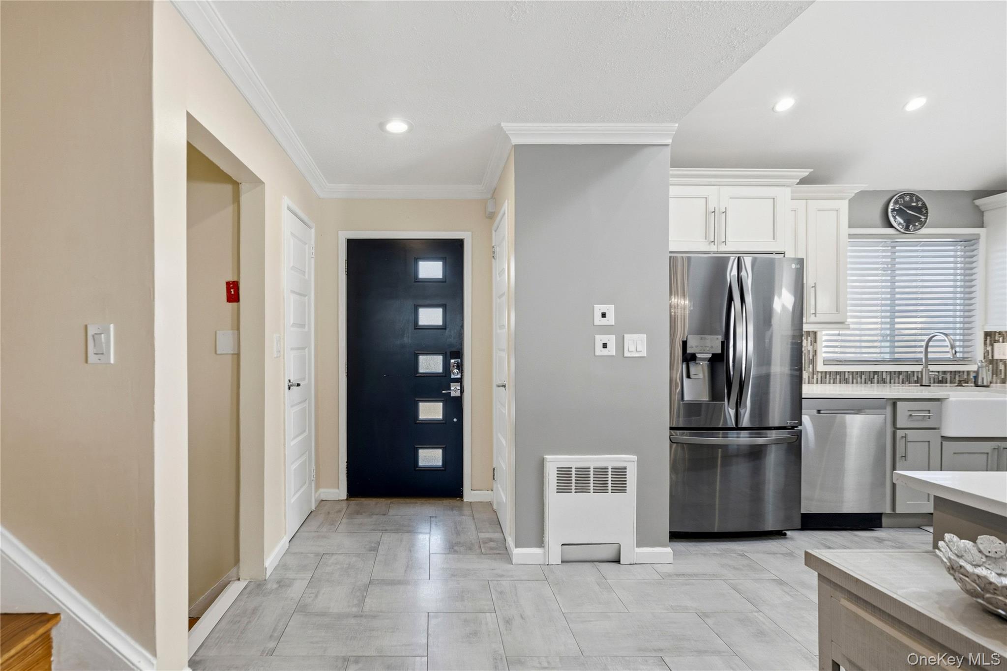 70 Forest Road Valley Stream, NY 11581 - Photo 7 of 43 a kitchen with stainless steel appliances granite countertop a refrigerator and a stove