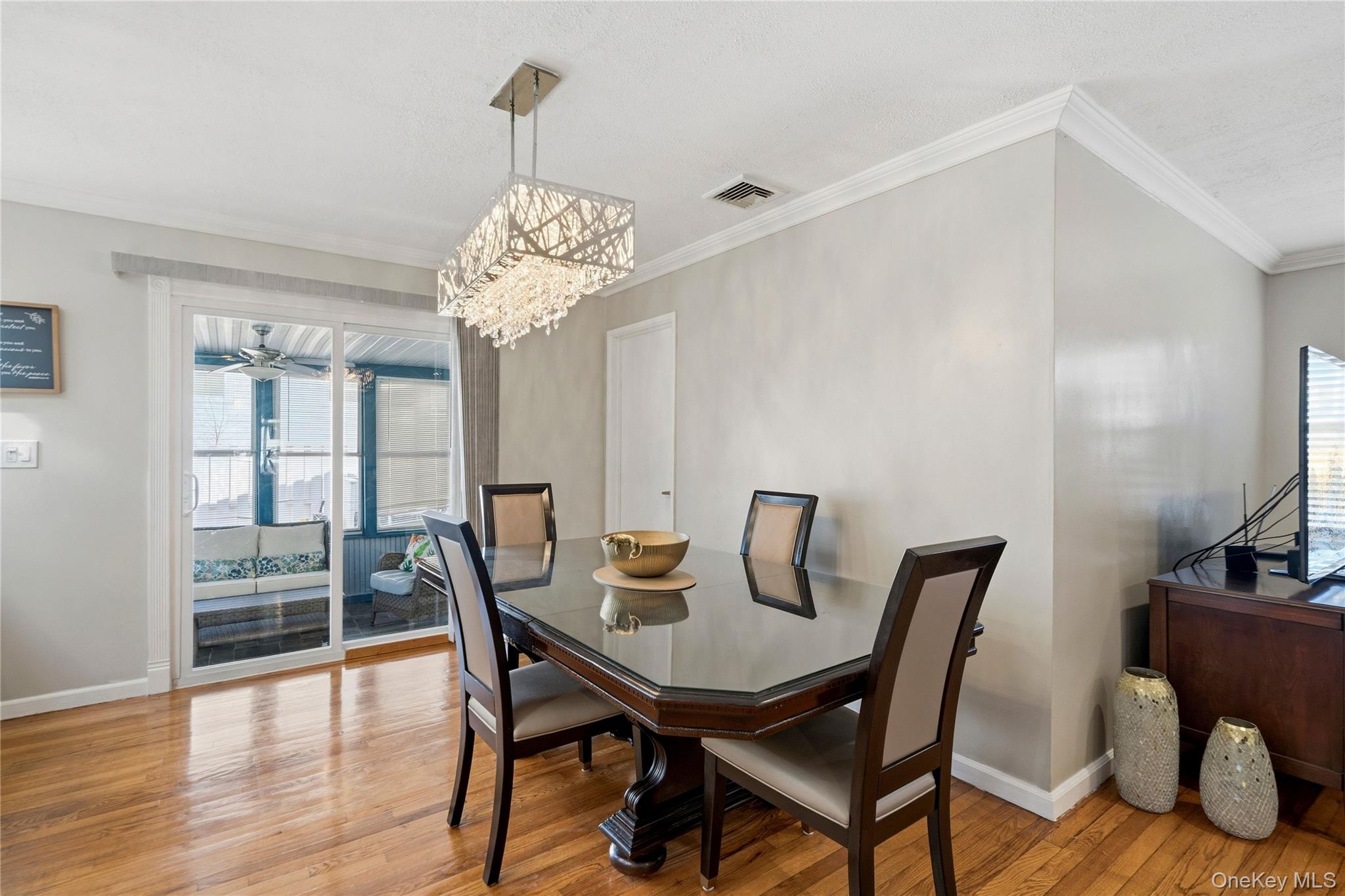 70 Forest Road Valley Stream, NY 11581 - Photo 10 of 43 a view of a dining room with furniture window and wooden floor