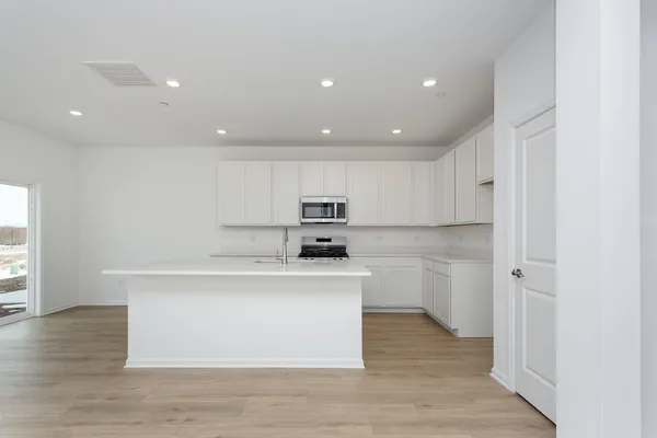 a view of kitchen with wooden floor