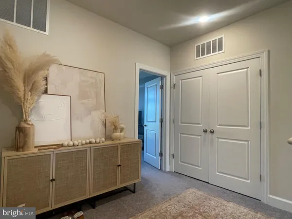 a room with cabinets and dust bin