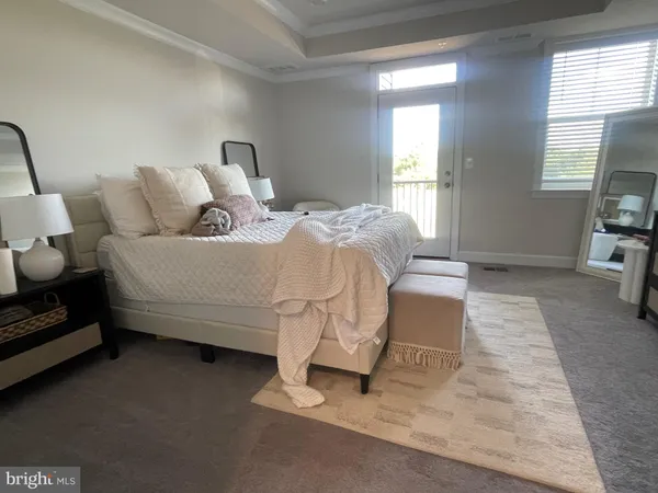 a bedroom with a bed and a tv on table