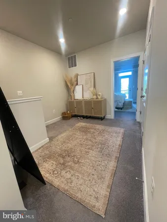 a view of a big room with closet and wooden floor