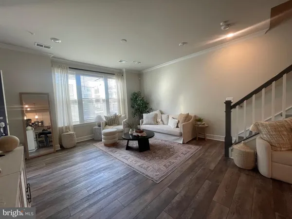 a living room with furniture and a couch