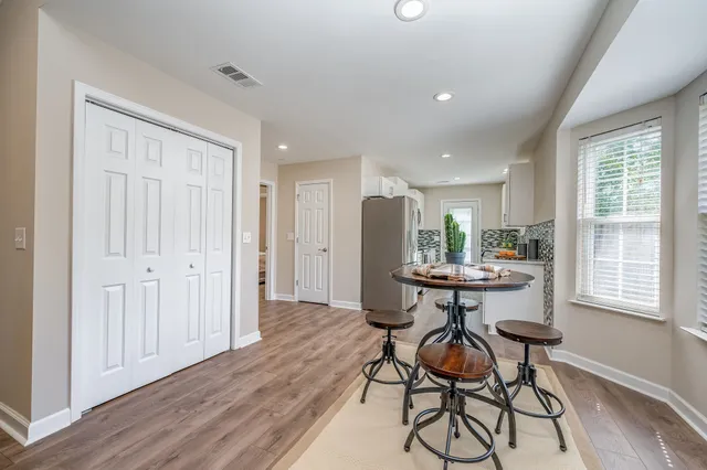 a view of a backyard with wooden fence