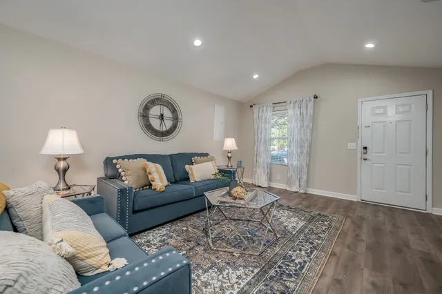 a living room with furniture and a table