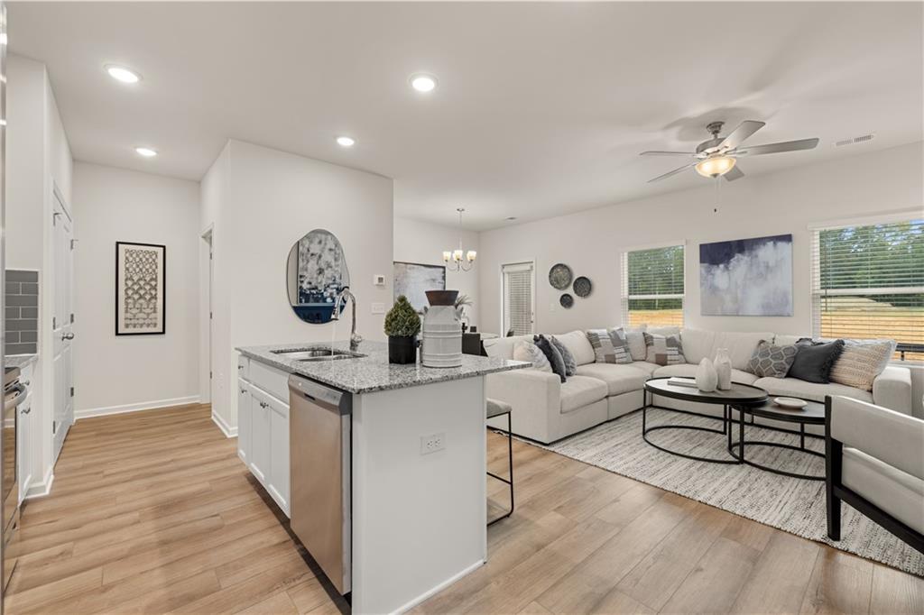 1018 Merritt Drive, Unit 10 Villa Rica, GA 30180 - Photo 4 of 20 a living room with furniture and a wooden floor