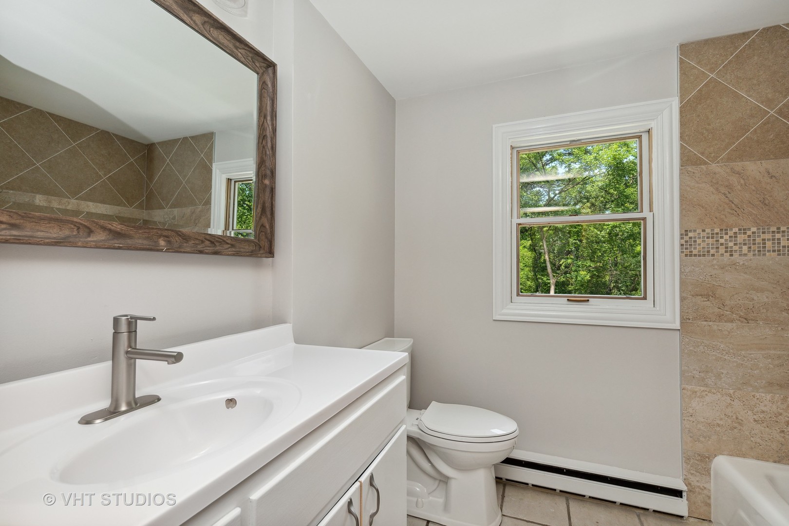 14933 Mill Road Capron, IL 61012 - Photo 12 of 15 a bathroom with a sink a toilet and a mirror