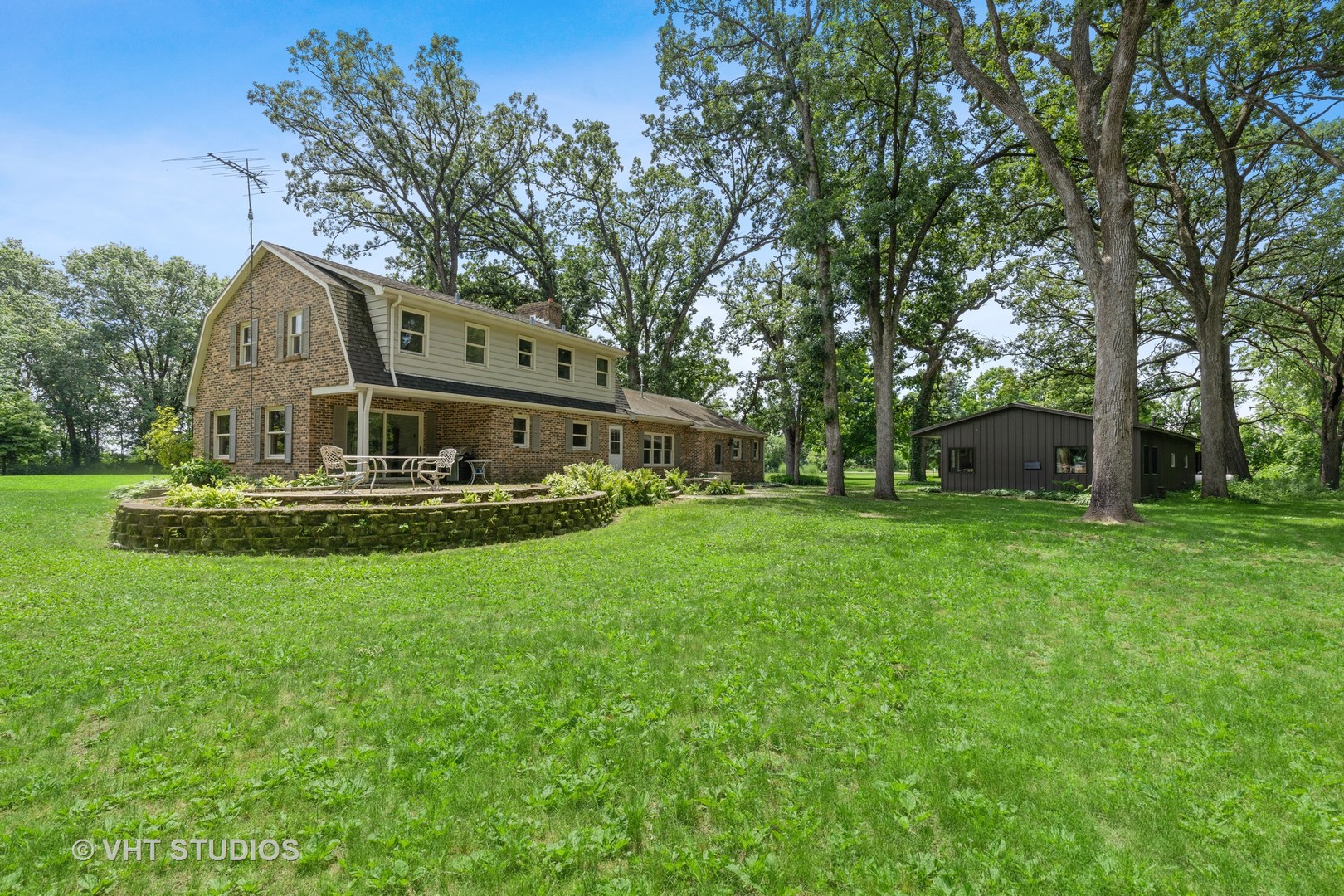 14933 Mill Road Capron, IL 61012 - Photo 15 of 15 a view of house with garden and trees
