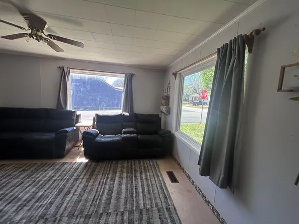 a living room with furniture and a rug