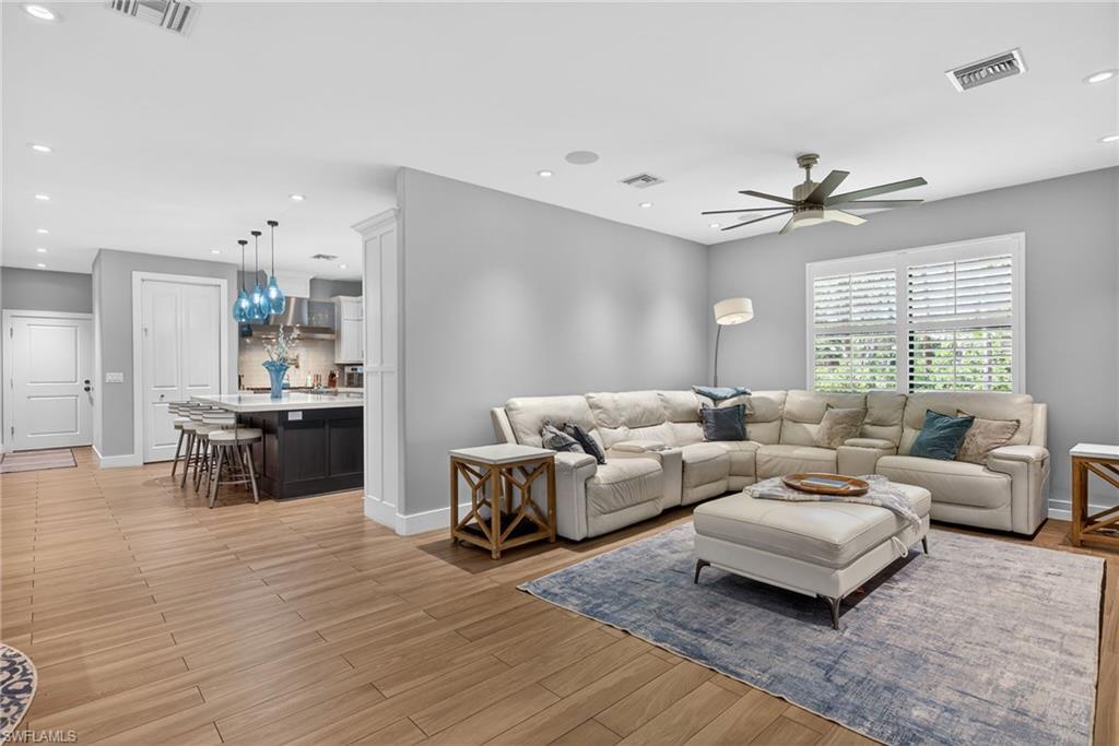 5577 Lancewood Way Naples, FL 34116 - Photo 16 of 44 a living room with furniture and a large window