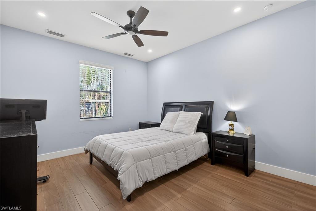 5577 Lancewood Way Naples, FL 34116 - Photo 24 of 44 a bedroom with a bed and a tv