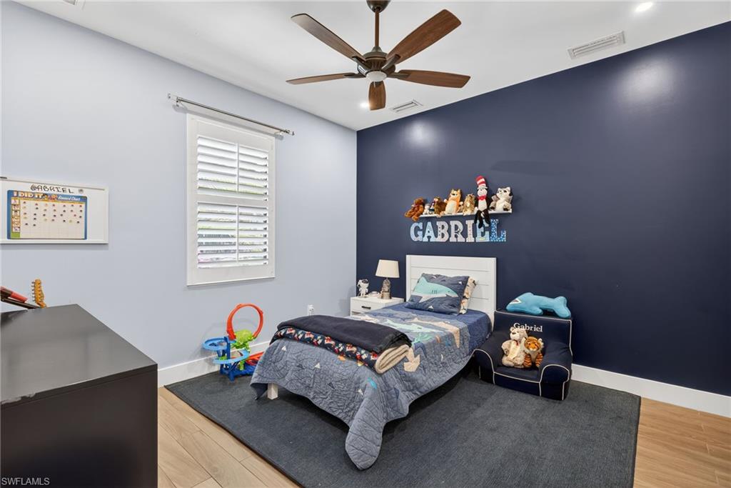 5577 Lancewood Way Naples, FL 34116 - Photo 27 of 44 a bedroom with a bed and a window