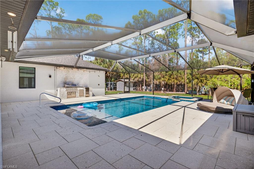 5577 Lancewood Way Naples, FL 34116 - Photo 36 of 44 a view of a backyard with swimming pool