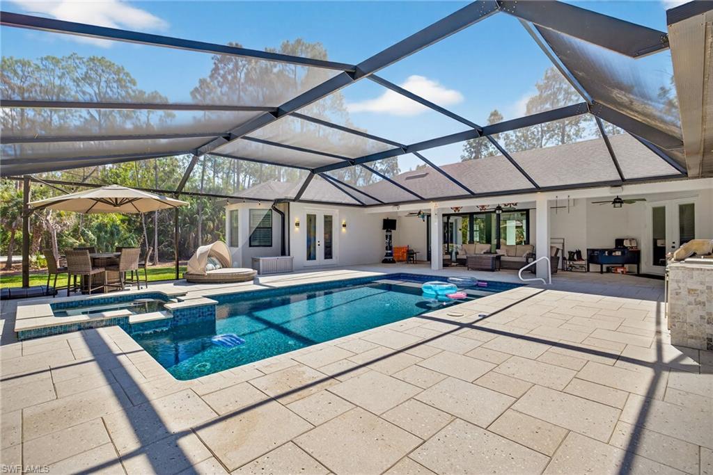 5577 Lancewood Way Naples, FL 34116 - Photo 37 of 44 a view of a patio with a table and chairs