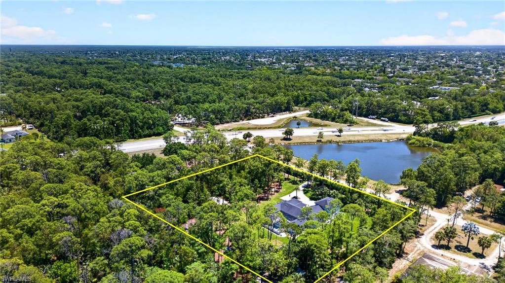 5577 Lancewood Way Naples, FL 34116 - Photo 40 of 44 an aerial view of a house with a yard