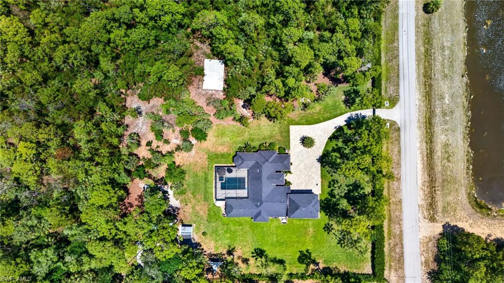 5577 Lancewood Way Naples, FL 34116 - Photo 44 of 44 an aerial view of a house with a yard