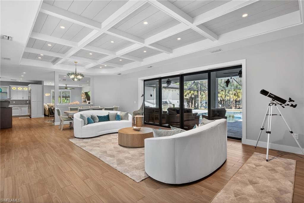 5577 Lancewood Way Naples, FL 34116 - Photo 6 of 44 a living room with furniture and a large window