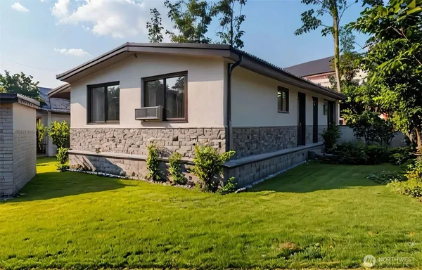 a view of house with backyard and garden