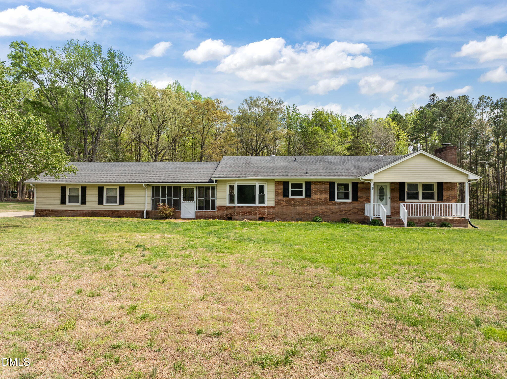 95 Harold Gill Road Roxboro, NC 27574 - Photo 1 of 53 a front view of a house with garden