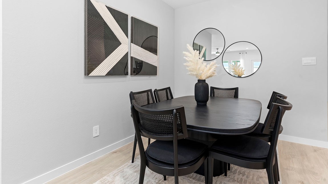 6004 Cherry Mdws Street Rosenberg, TX 77469 - Photo 11 of 39 a dining room with furniture and a mirror