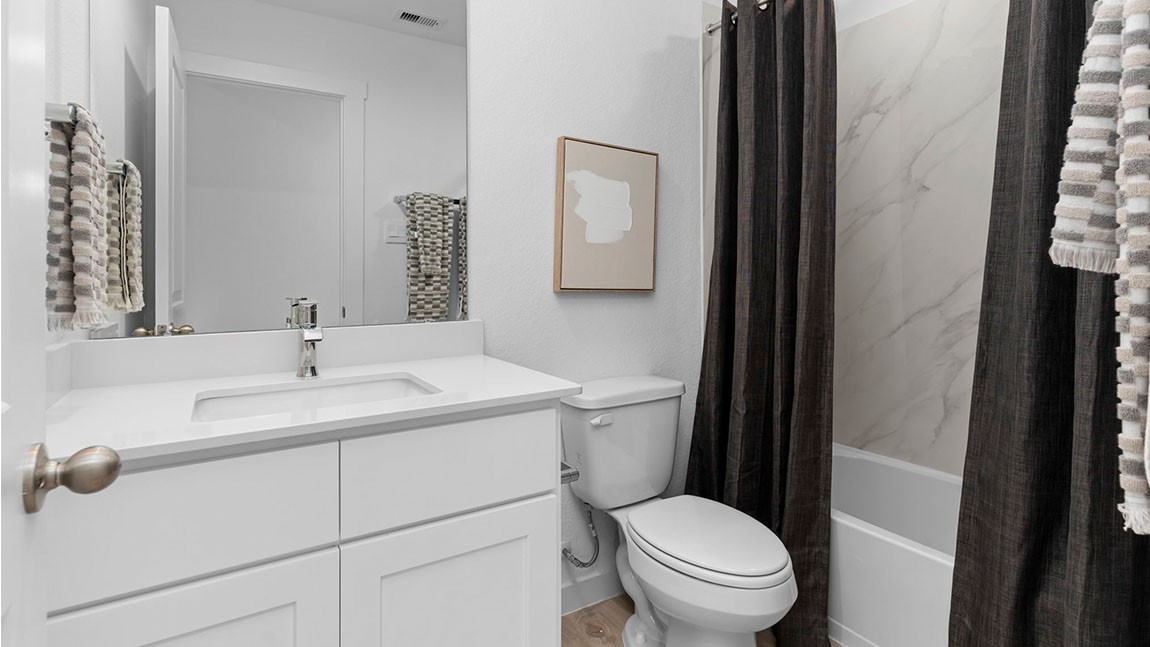 6004 Cherry Mdws Street Rosenberg, TX 77469 - Photo 13 of 39 a bathroom with a toilet sink and mirror