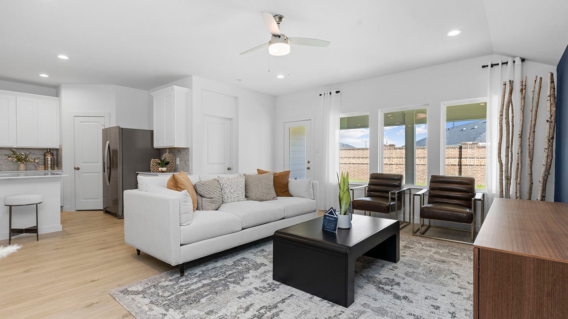 6004 Cherry Mdws Street Rosenberg, TX 77469 - Photo 19 of 39 a living room with furniture and a fireplace