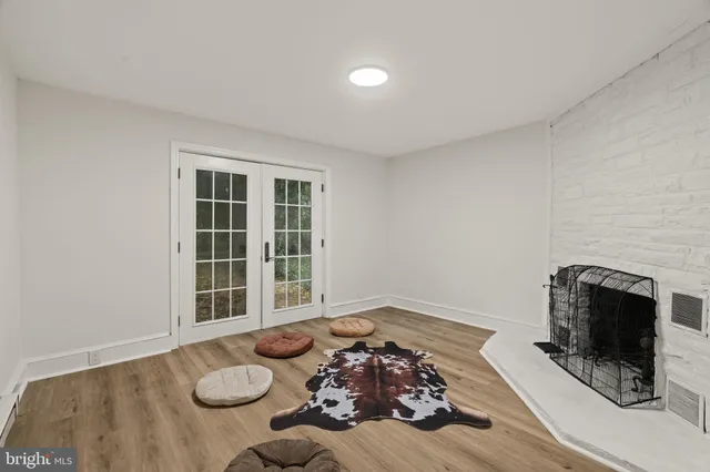 a view of a livingroom with furniture and a fireplace