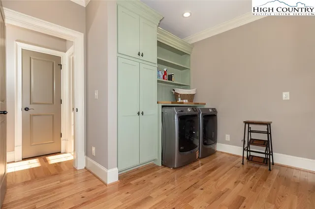 a view of kitchen and entryway with wooden floor