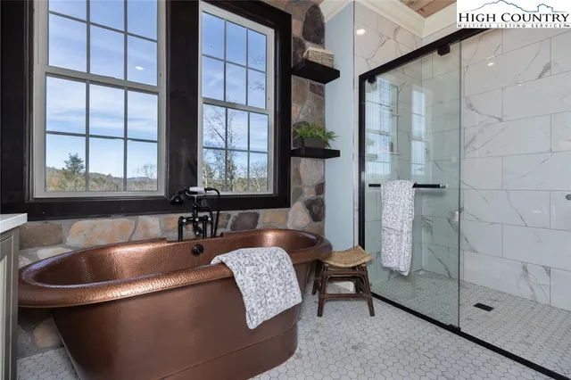 a bath tub sitting next to a window