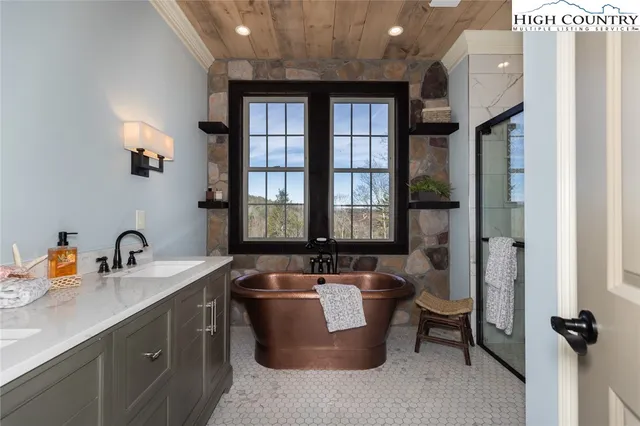 a spacious bathroom with a bathtub and sink