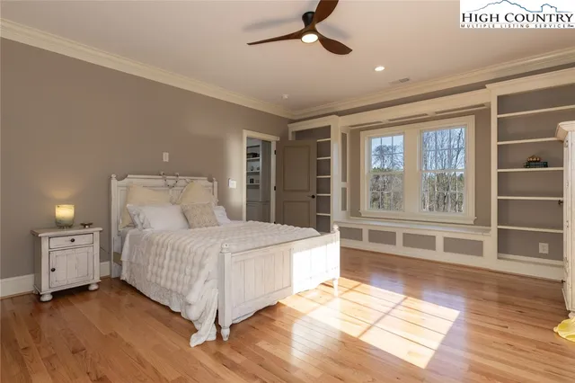 a bed room with a bed and a window