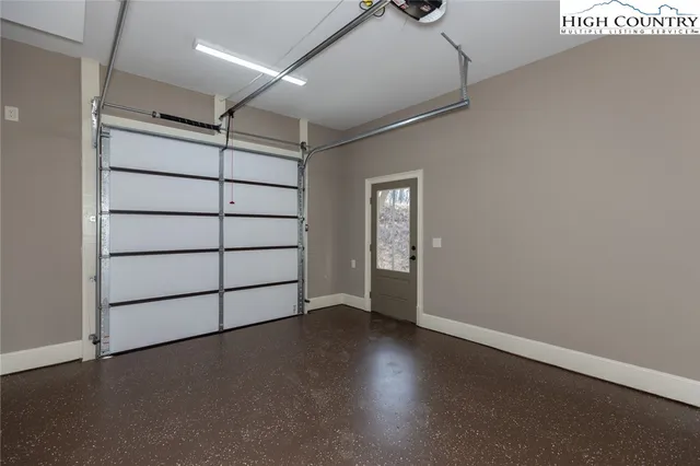 an empty room with a empty space and windows