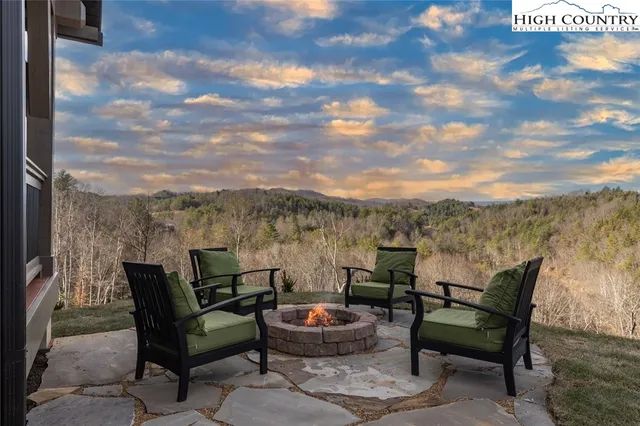 a view of a balcony with furniture and wooden floor