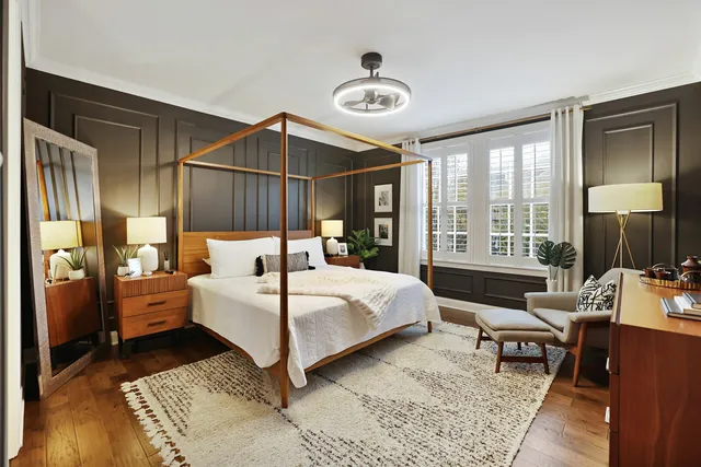 a bed room with a bed and a window