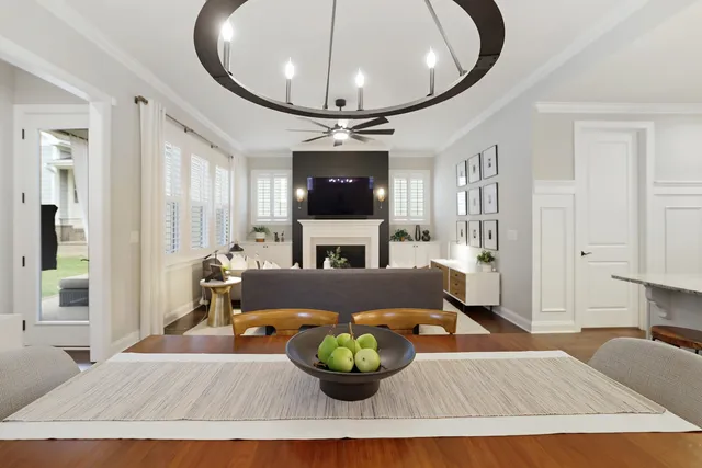 a living room with furniture fireplace and flat screen tv