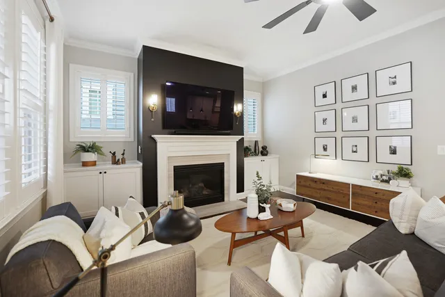 a living room with furniture and a fireplace