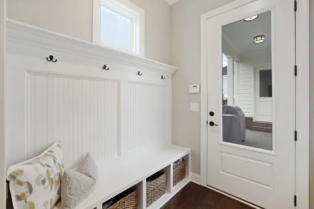 a bedroom with a bed and a large mirror