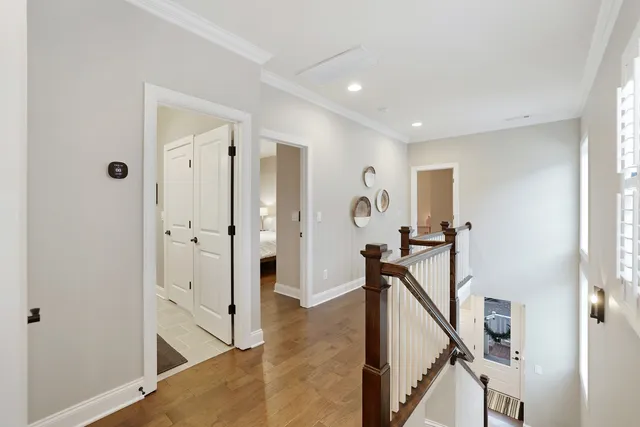 a view of a bedroom bathroom and wooden floor