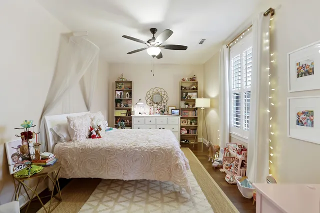 a view of living room with furniture and a mirror